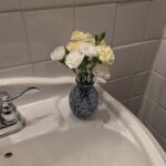 small vase on a powder room sink