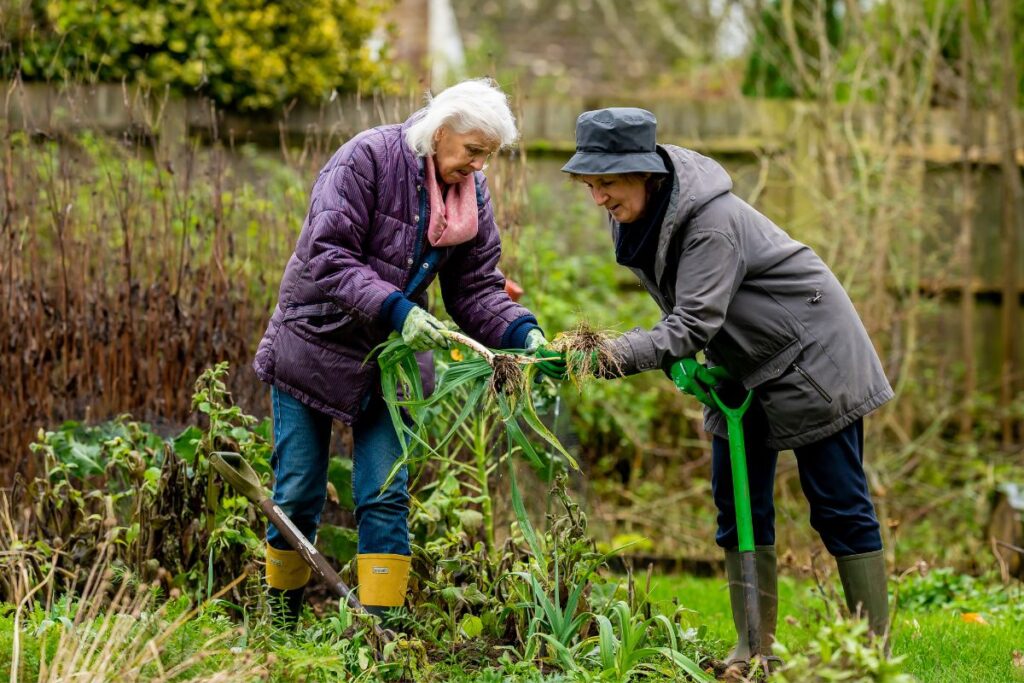 Two women gaining health benefits from gardening